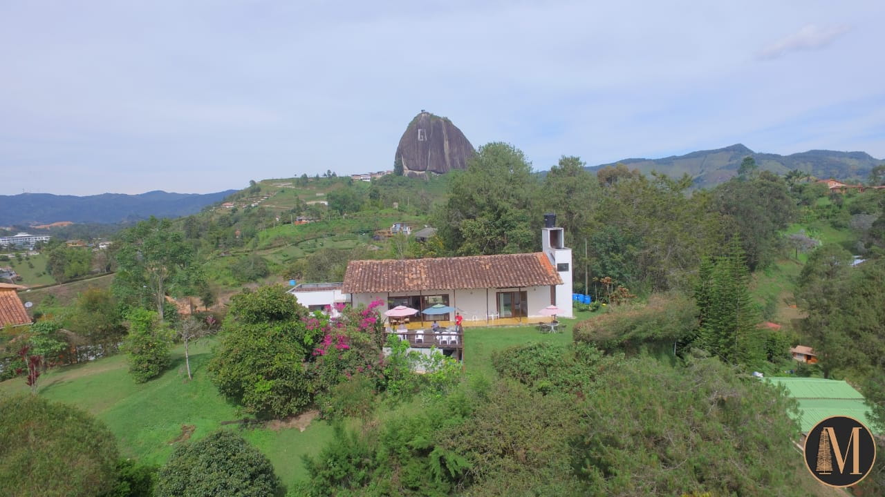 Cabin overlooking the Guatapé reservoir and El Peñol Rock